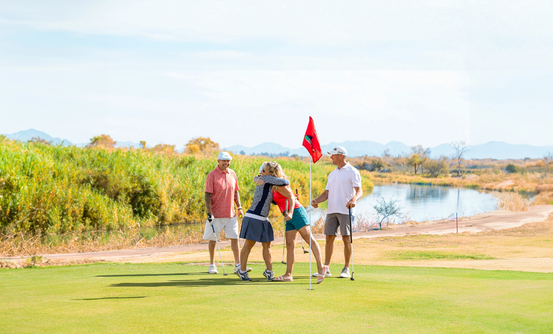 Two couples having a fun afternoon on the Cocopah Resort Golf Course
